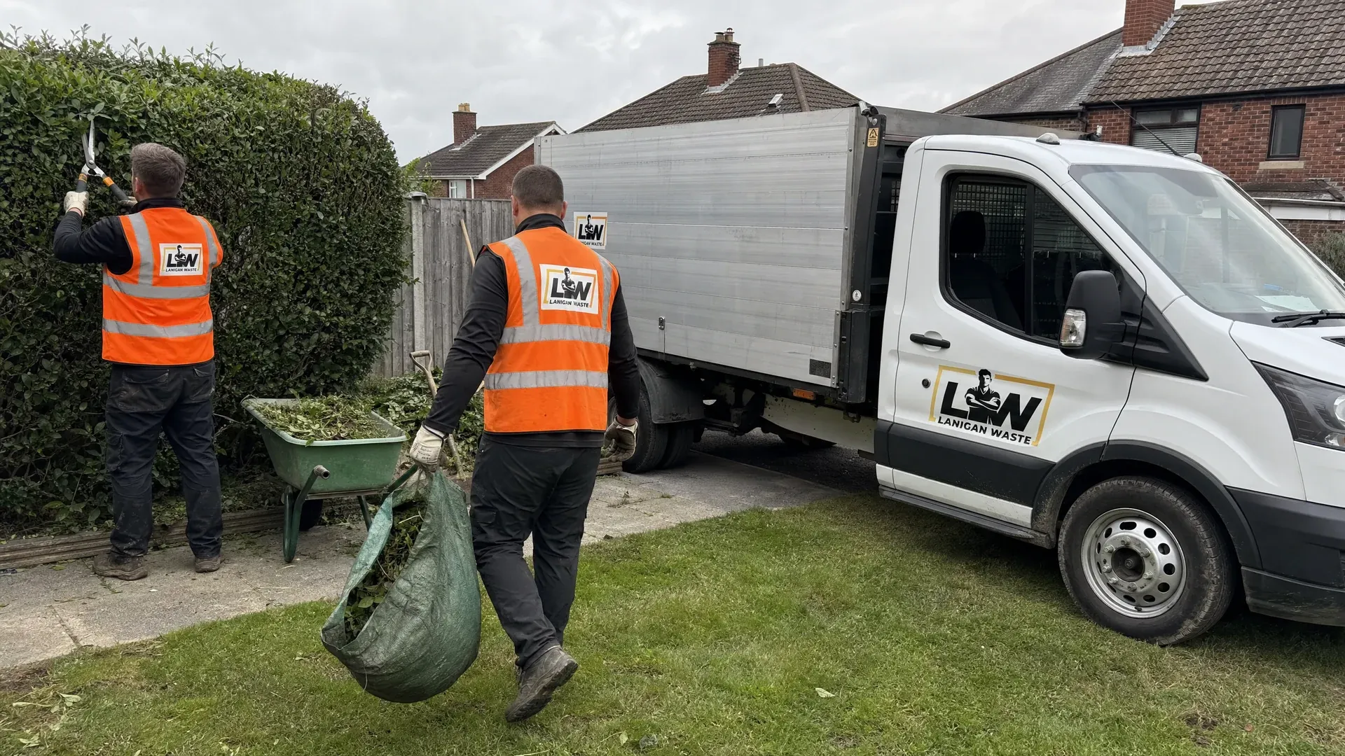 Lanigan Waste crew landscaping a garden