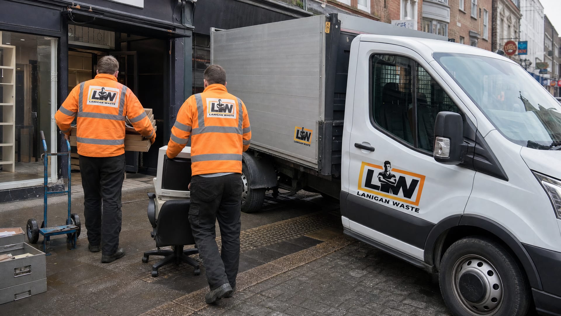 Lanigan Waste crew clearing office furniture from a unit in Kingston upon Thames