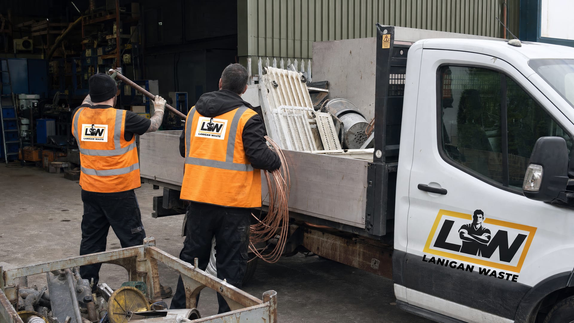 Lanigan Waste crew collecting scrap metal